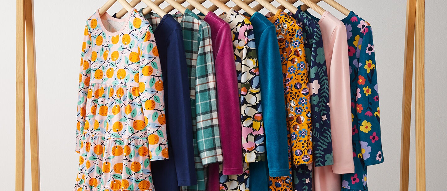 Row of different dresses on hangers
