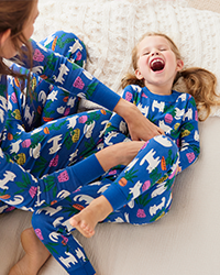 Mom and daughter wearing matching lama pajamas