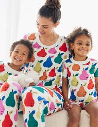 family wearing matching pear pajamas