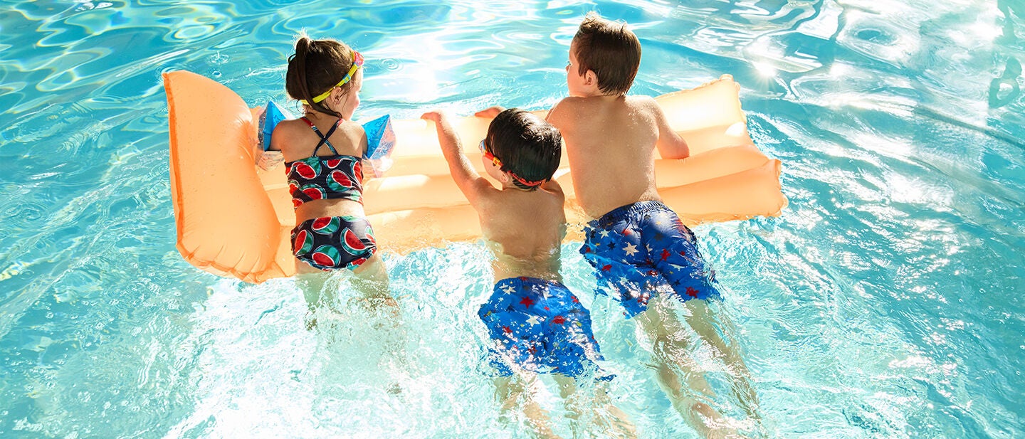 kids swimming in a pool