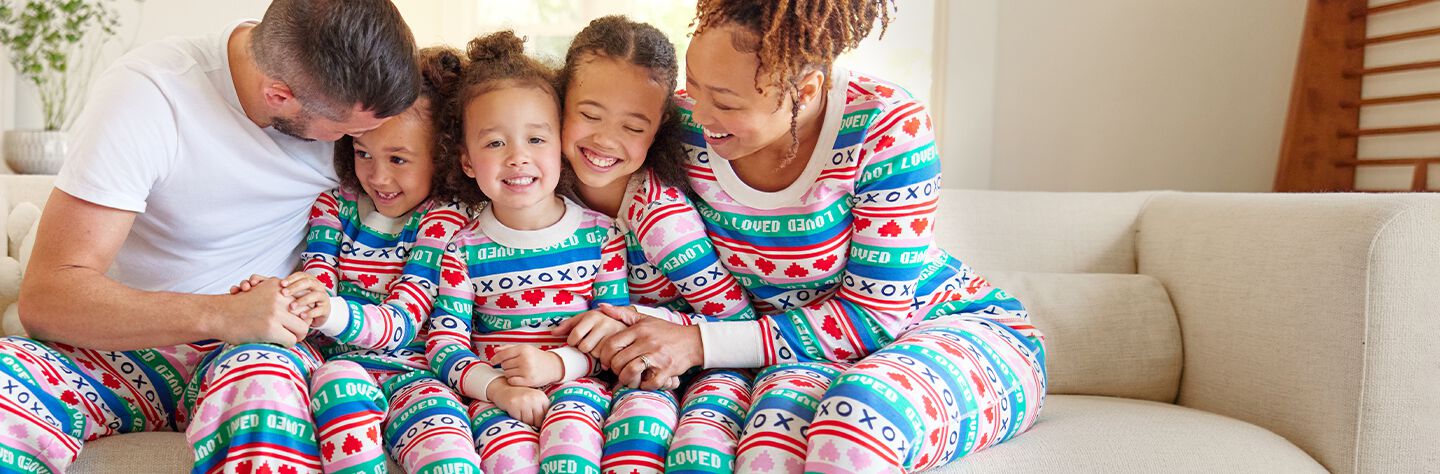 family wearing valentine's fairisle printed matching family pjs. shop now.