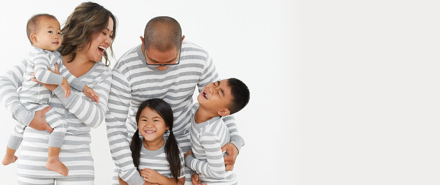 Family in matching stripe pajamas