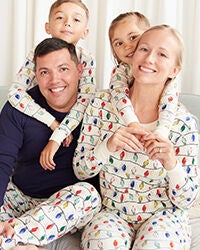 family in matching christmas light pajamas
