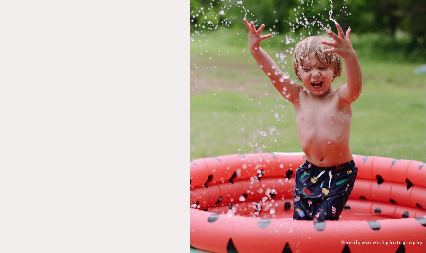 Boy splashing in a small pool Boy splashing in a small pool