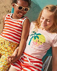 Girls, two girls wearing tank top, tee and shorts, shop girls