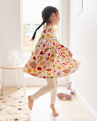 girl twirling in fall dress