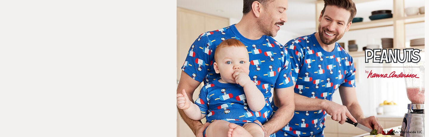 Two men and a baby wearing Snoopy print short johns Two men and a baby wearing Snoopy print short johns