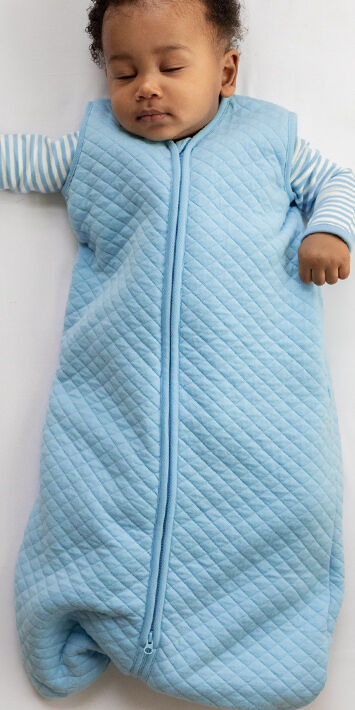 Baby in blue wearable blanket