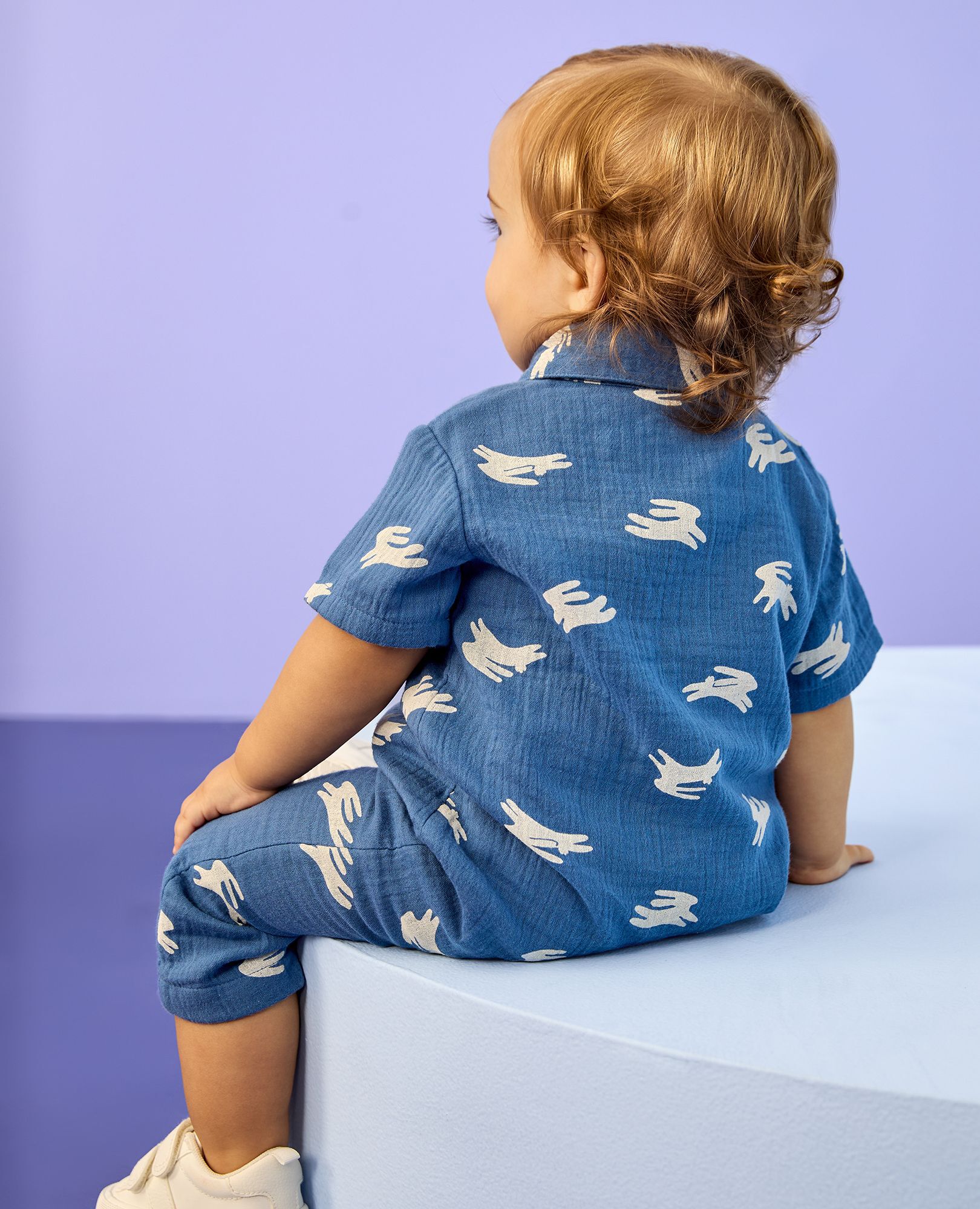 Baby Easter Muslin Romper in Hopping Bunnies on Blue - main