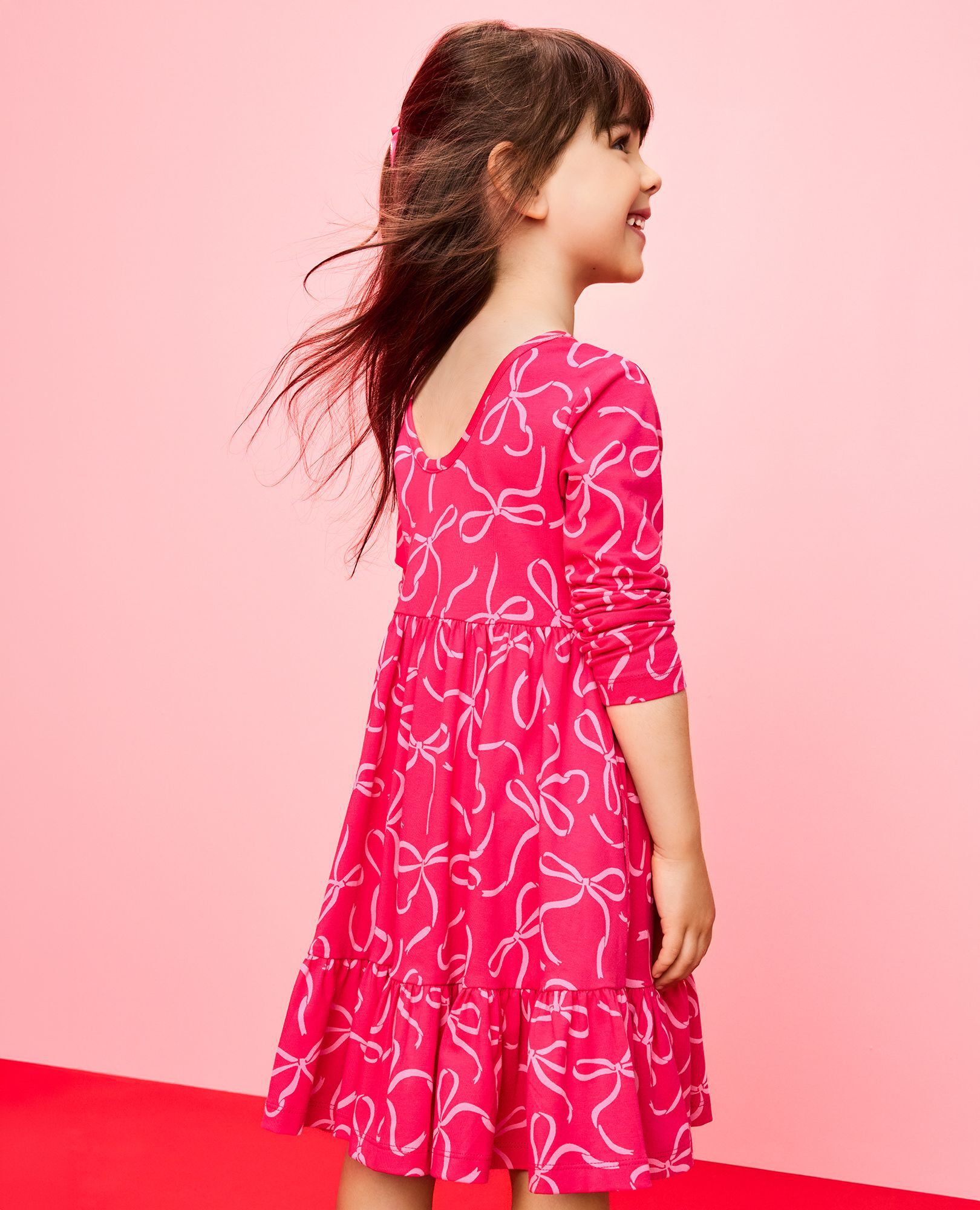 Long Sleeve Ruffle Skater Dress with Pockets in Bows on Beetroot Pink - main