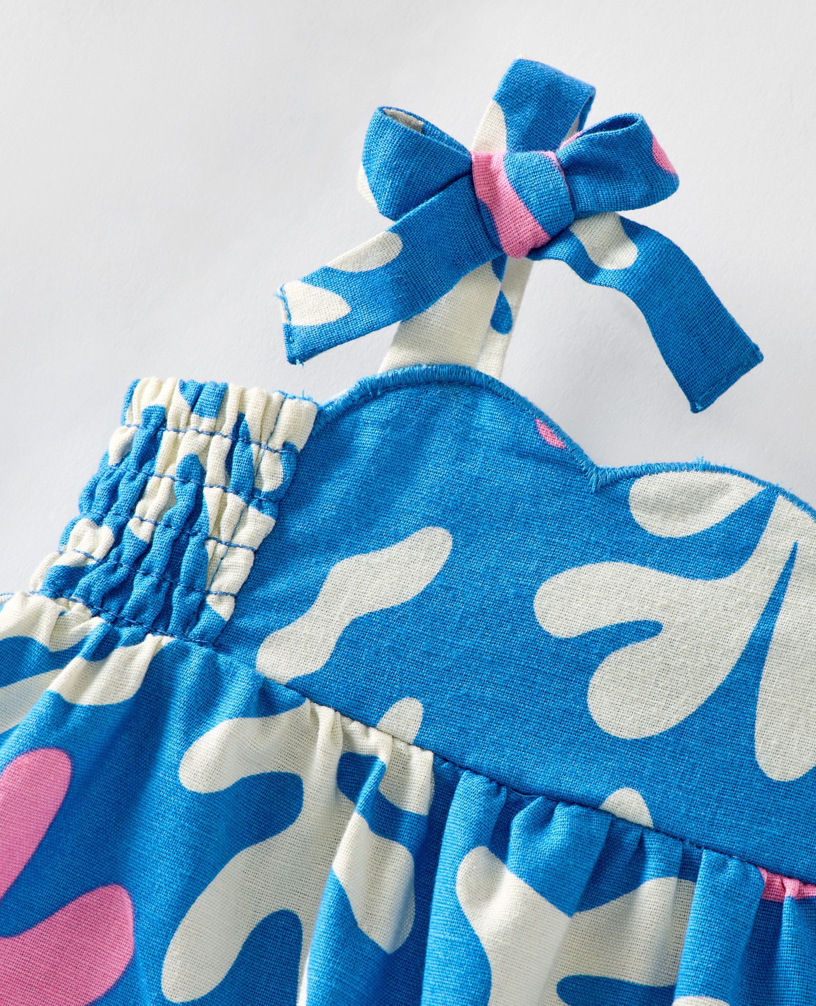 Baby Sleeveless Linen Bow Strap Dress in Coral on Swedish Sky - main