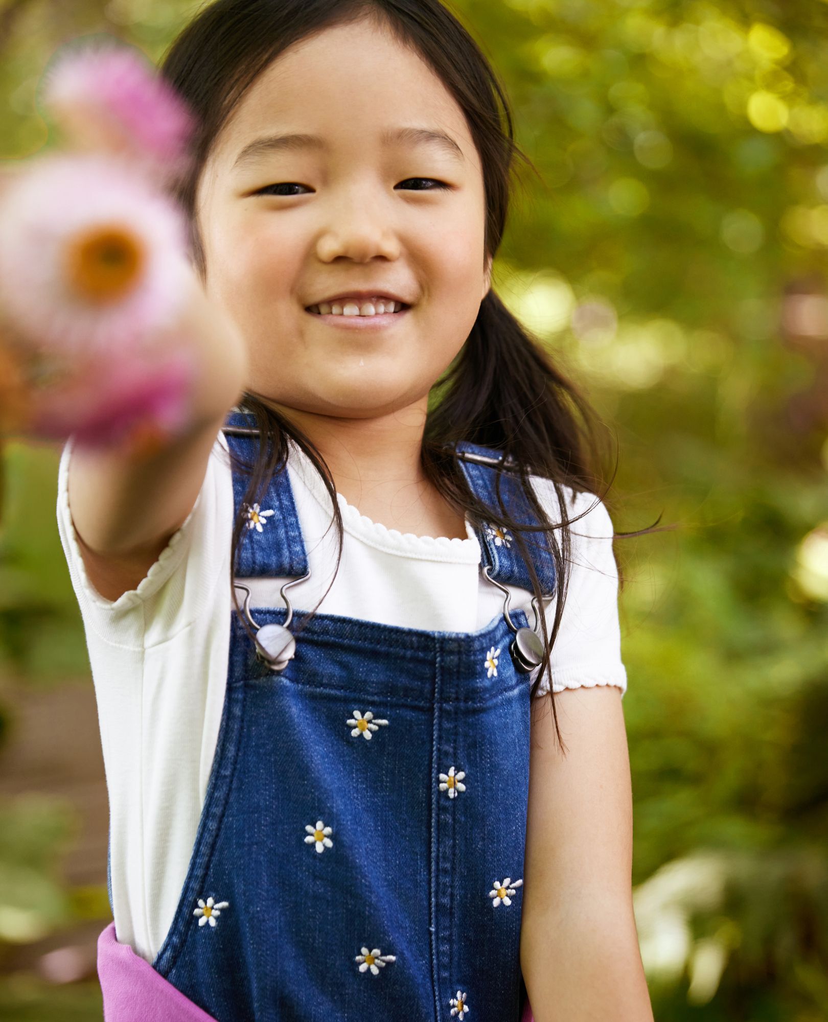 Little girl in overalls on sale