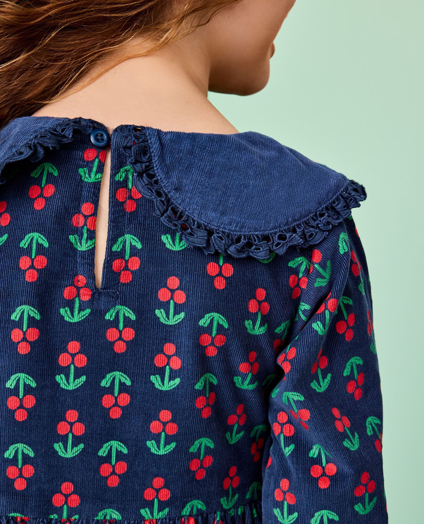 Embroidered Corduroy Dress with Pockets in Holly Berries on Midnight Blue - main