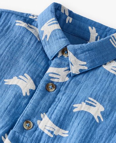 Baby Easter Muslin Romper in Hopping Bunnies on Blue - main