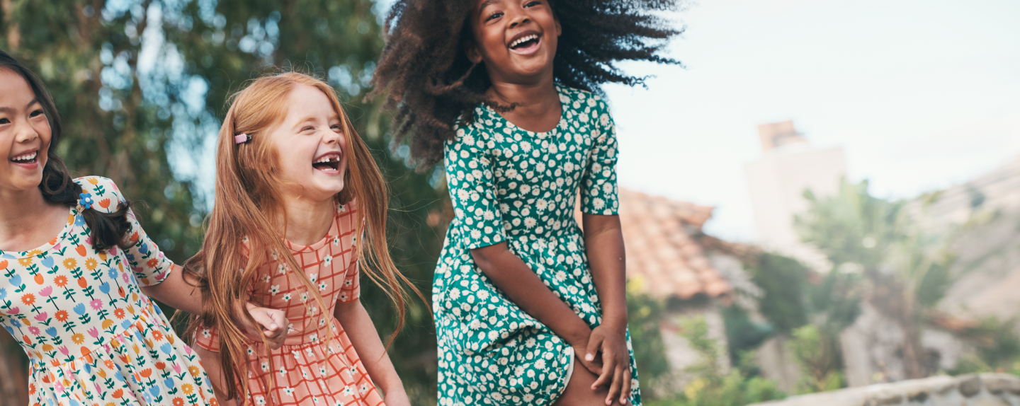 three girls in dresses