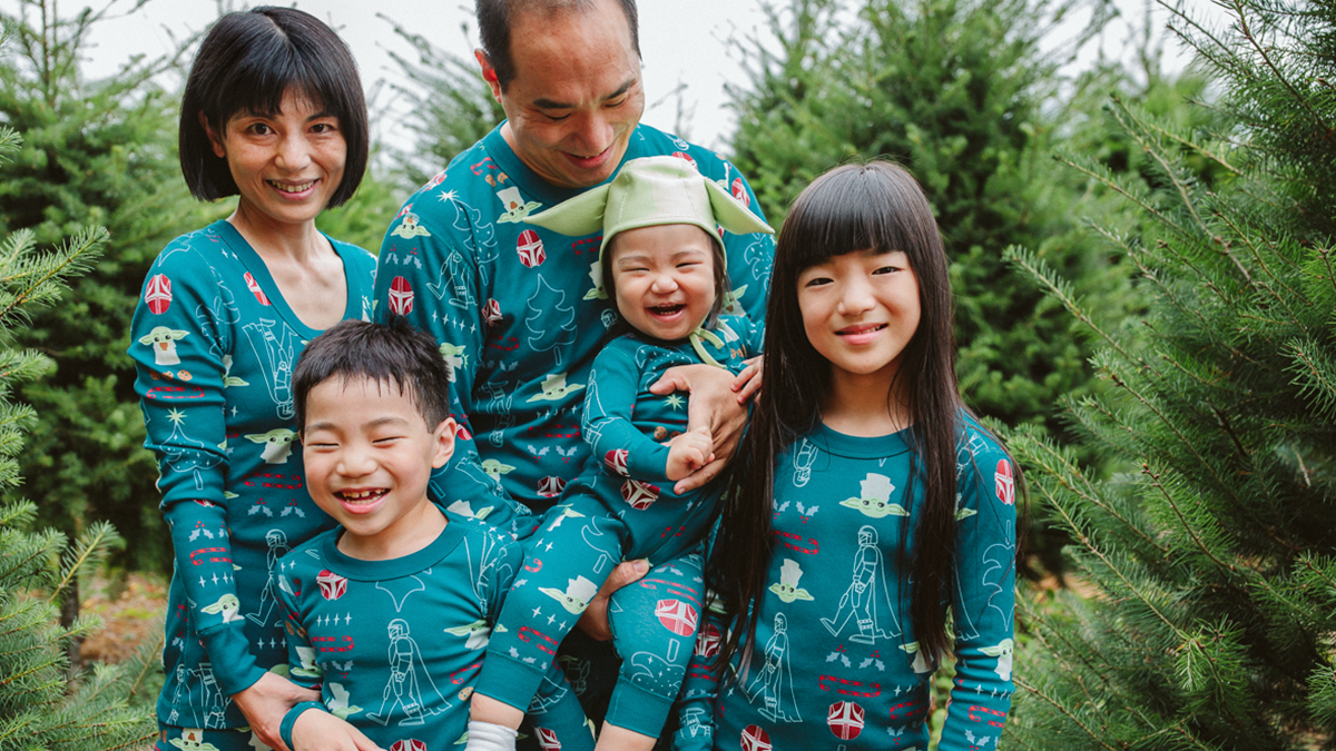 family in matching mandalorian holiday pajamas