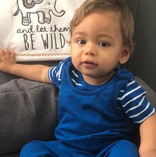Boy in blue overalls