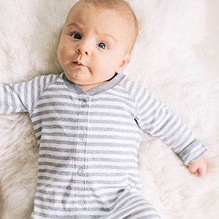Baby in grey stripe sleeper