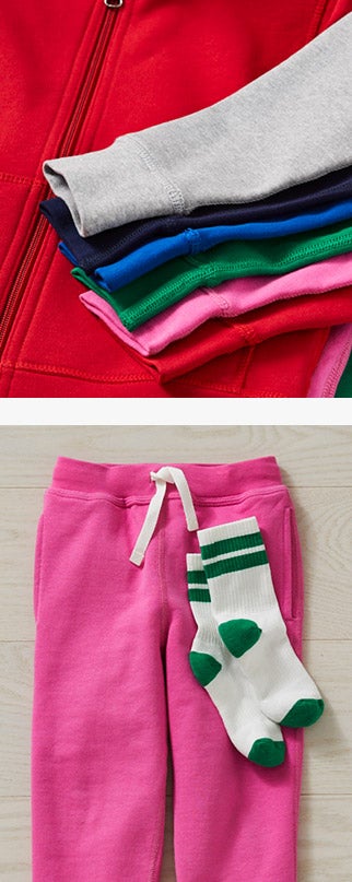 a sack of different color sweaters and sweatpants