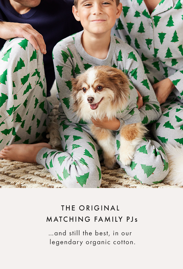 a kid and their dog wearing matching Tanenbaum pajamas