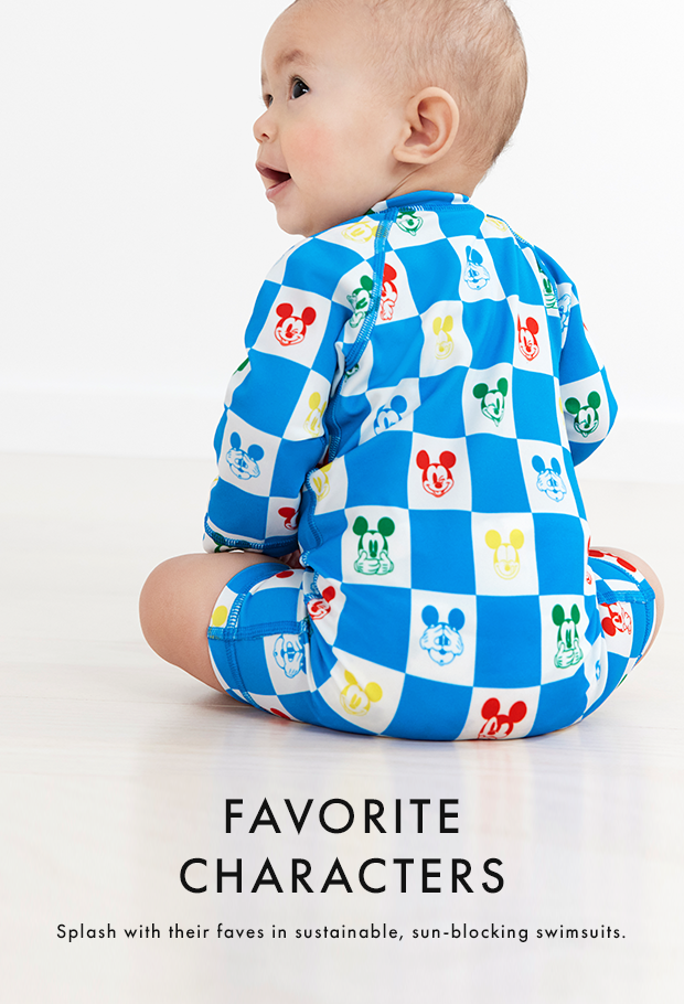 baby wearing blue and white checkered mickey rash guard