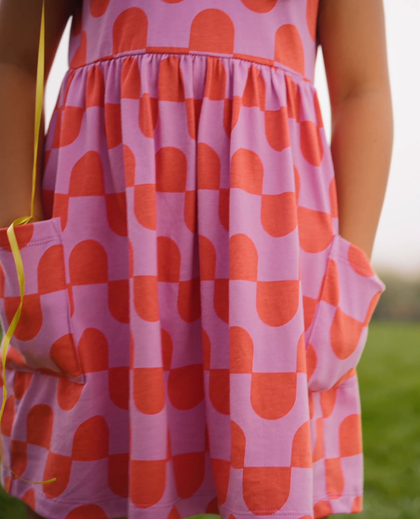 Video of child wearing Playground Dress with Pockets