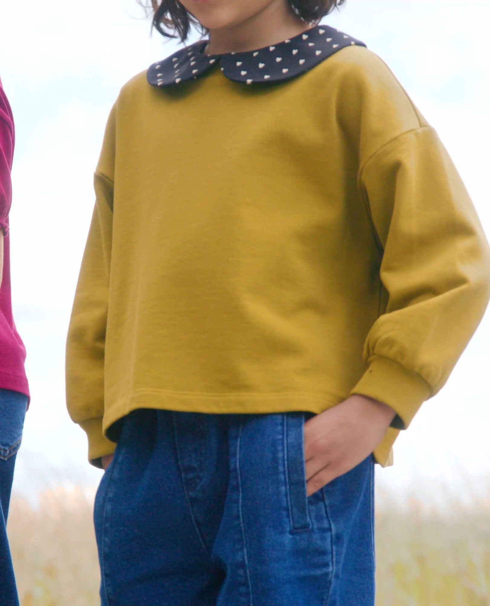 Video of child wearing Balloon Sleeve French Terry Sweatshirt