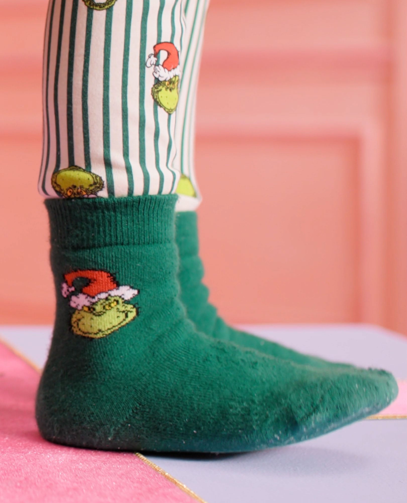 Video of child wearing Dr. Seuss Grinch Socks