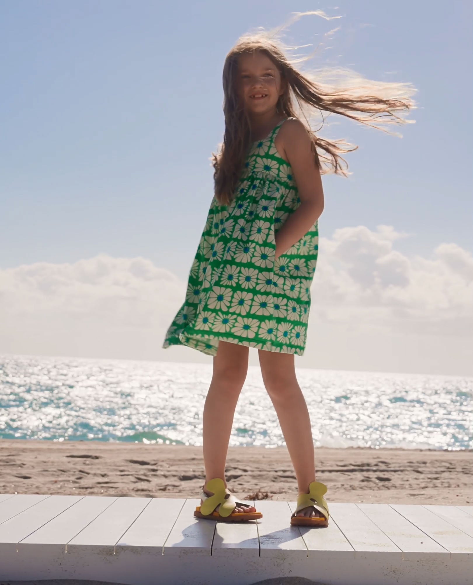 Video of child wearing Sleeveless Back Cut Out Dress with Pockets