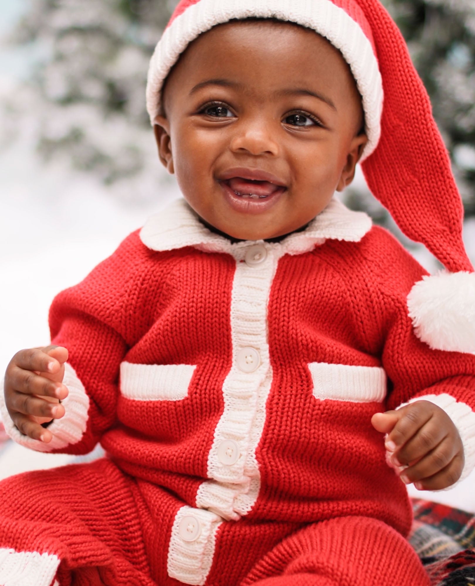 Video of child wearing Baby Santa Sweater Romper & Hat Set