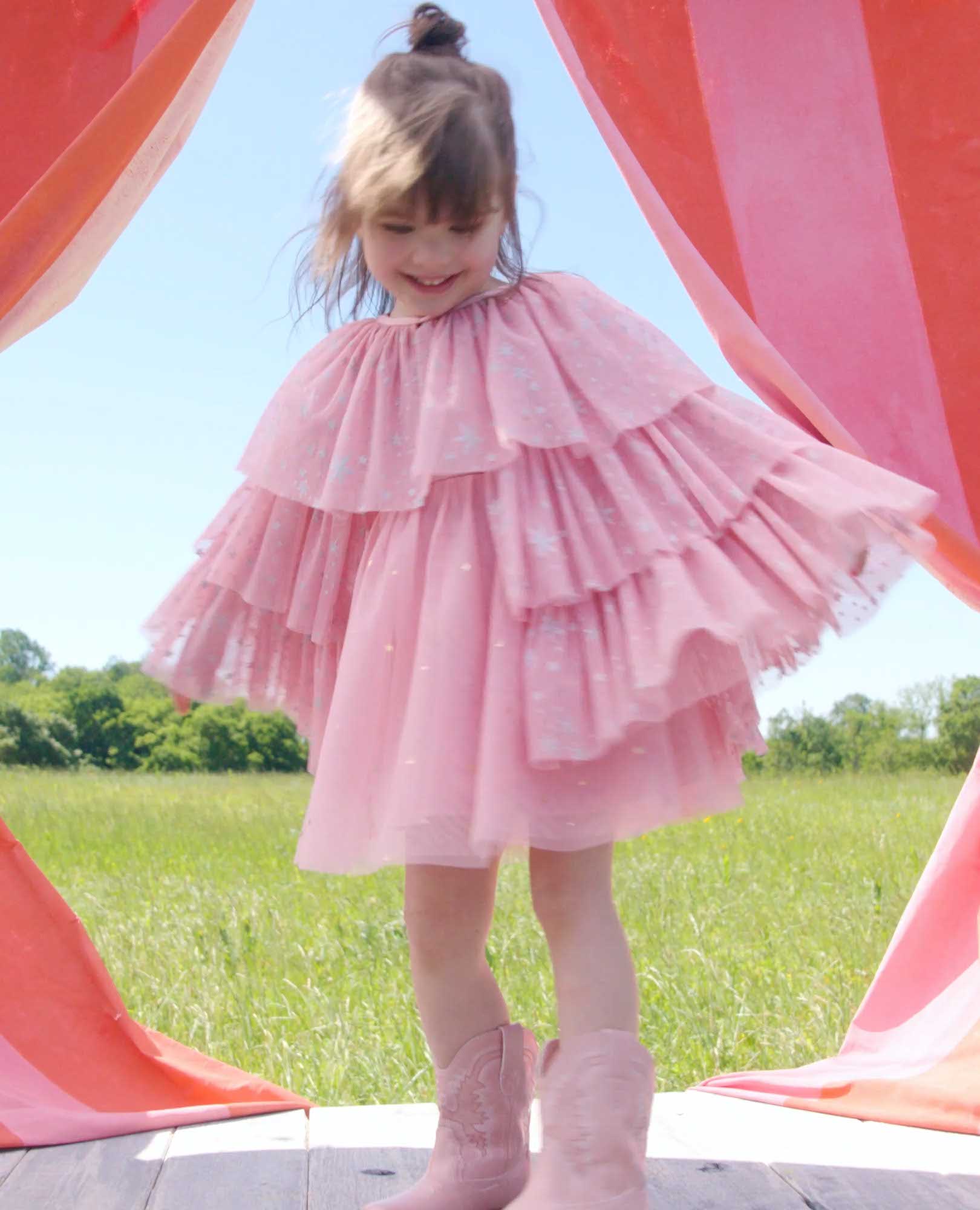 Video of child wearing Shimmer Tulle Ruffle Capelet
