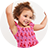 Girl with arms in air wearing strawberry dress